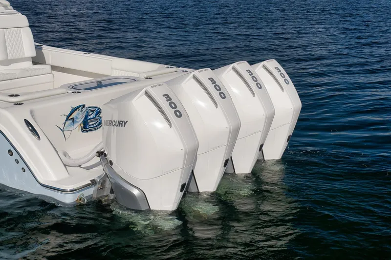 Slide: The Image of 2022 Invincible 39 Open Fisherman with four Mercury 300 engines on water. - 10