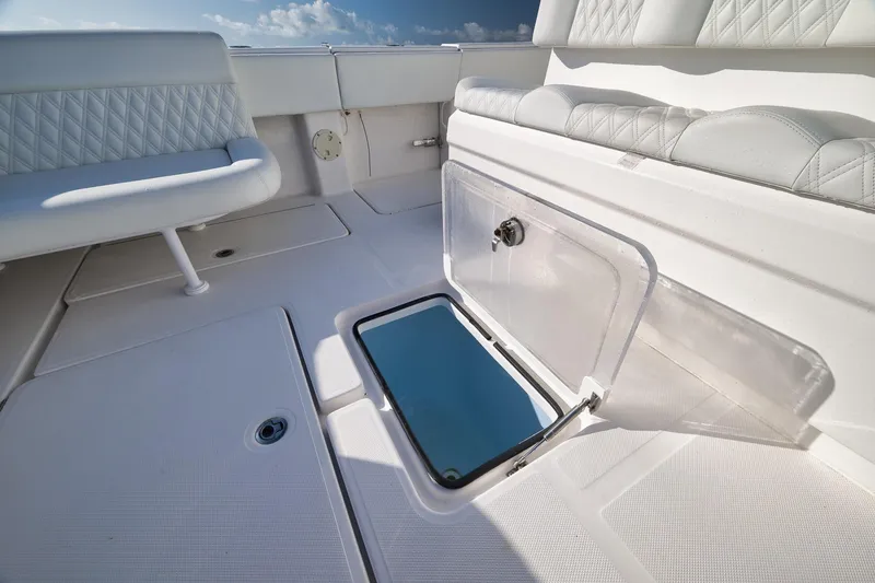 Slide: The Image of 2022 Invincible 39 Open Fisherman boat interior with open storage compartment. - 16