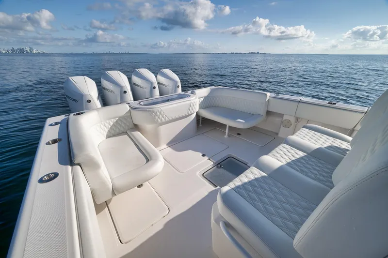 Slide: The Image of 2022 Invincible 39 Open Fisherman boat with luxurious seating and multiple Mercury engines. - 18