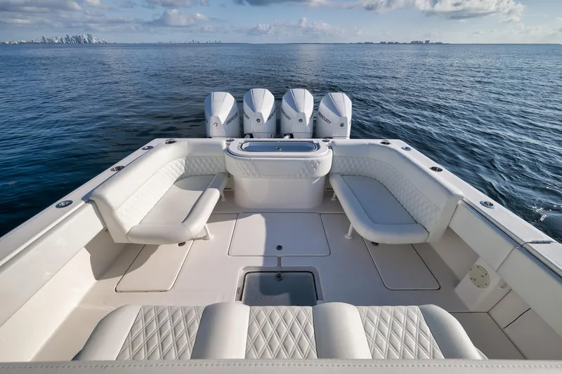Slide: The Image of 2022 Invincible 39 Open Fisherman boat with spacious seating and multiple outboard engines. - 19