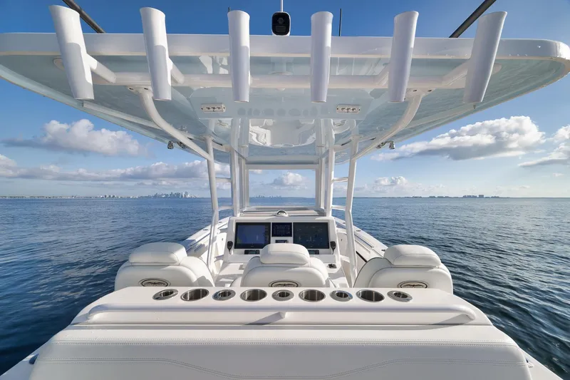 Slide: The Image of 2022 Invincible 39 Open Fisherman boat on calm ocean waters under blue sky. - 20