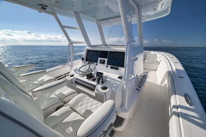 Slide: The Image of 2022 Invincible 39 Open Fisherman boat interior with modern helm and ocean view. - 22