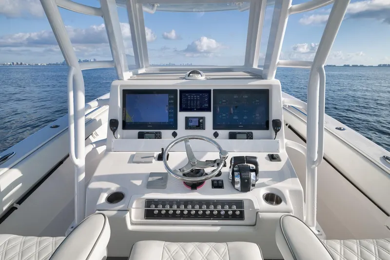 Slide: The Image of 2022 Invincible 39 Open Fisherman boat helm with advanced navigation displays. - 24