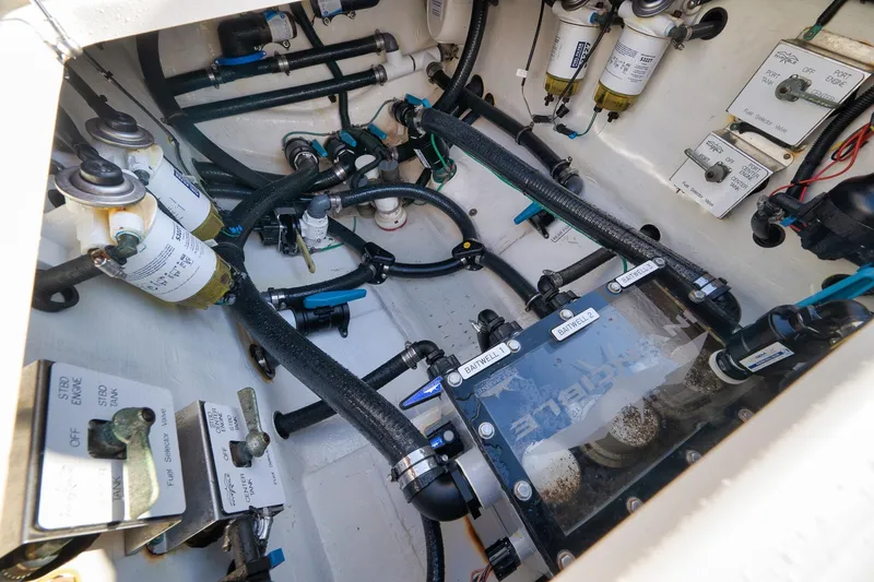 Slide: The Image of Engine compartment of 2022 Invincible 39 Open Fisherman with fuel and water systems. - 31
