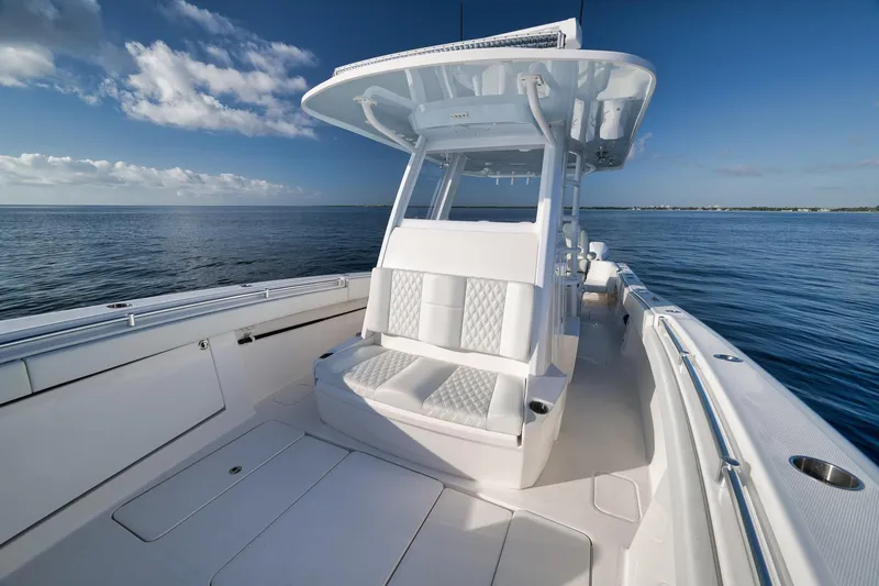 Slide: The Image of 2022 Invincible 39 Open Fisherman boat on calm ocean waters. - 32