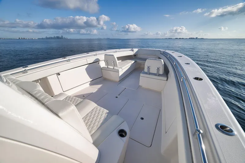 Slide: The Image of 2022 Invincible 39 Open Fisherman boat on calm ocean waters, showcasing spacious deck. - 33