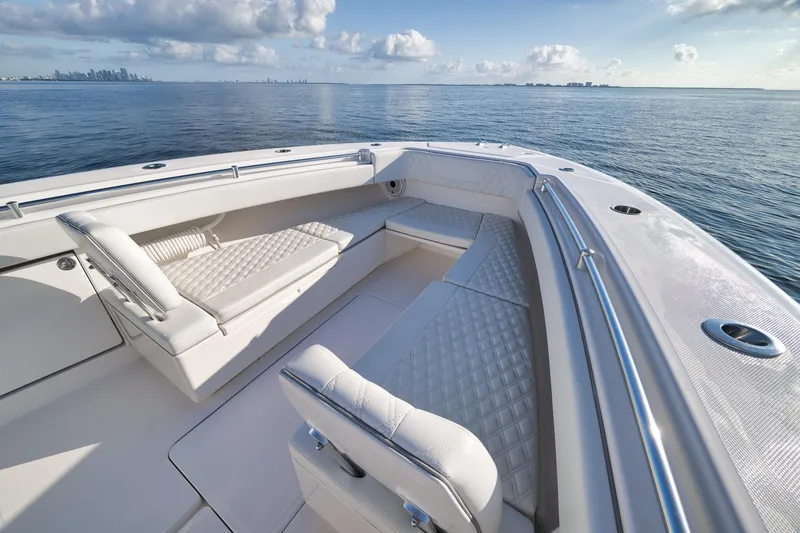 Slide: The Image of 2022 Invincible 39 Open Fisherman boat with luxurious seating on calm ocean waters. - 34