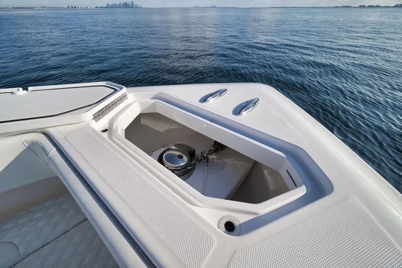 Slide: The Image of 2022 Invincible 39 Open Fisherman boat with anchor compartment, on calm ocean waters. - 37