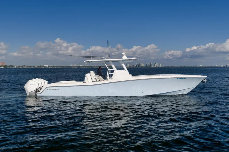 Slide: The Image of 2022 Invincible 39 Open Fisherman boat on calm ocean waters under blue sky. - 8
