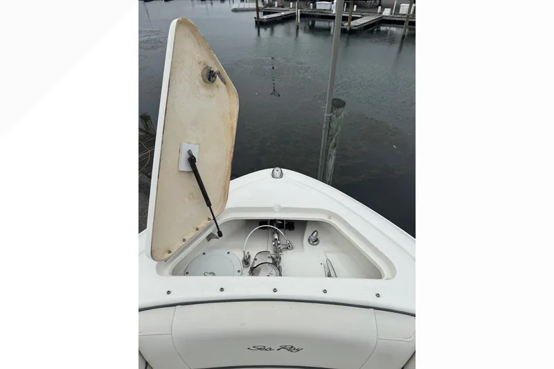 Slide: The Image of 2007 Sea Ray 270 SLX boat with open anchor compartment at dock. - 14