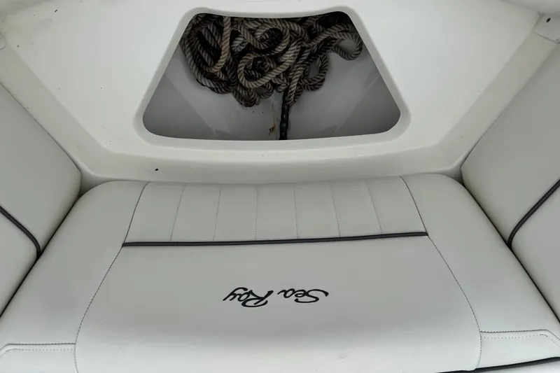 Slide: The Image of White leather seating on a 2007 Sea Ray 270 SLX boat with rope storage. - 17