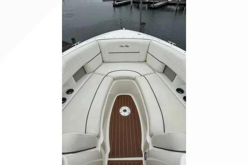 Slide: The Image of 2007 Sea Ray 270 SLX boat interior with white seating and wood flooring. - 19
