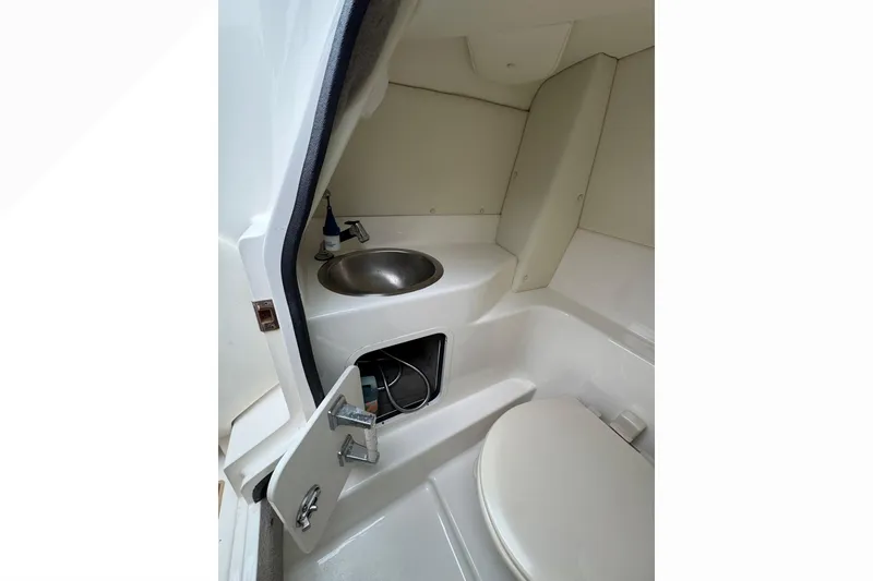 Slide: The Image of 2007 Sea Ray 270 SLX boat interior with sink and storage compartment. - 22