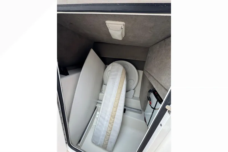 Slide: The Image of Interior cabin of 2007 Sea Ray 270 SLX boat, featuring storage and seating. - 24