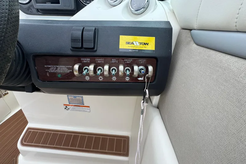 Slide: The Image of Control panel of a 2007 Sea Ray 270 SLX boat with labeled switches. - 29
