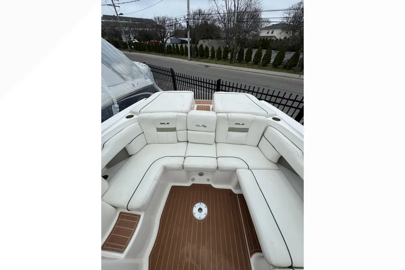 Slide: The Image of 2007 Sea Ray 270 SLX boat interior with white seating and teak flooring. - 38
