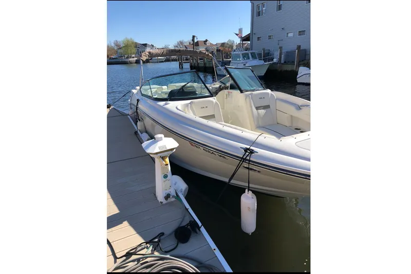 Slide: The Image of 2007 Sea Ray 270 SLX boat docked at marina, sunny day, calm water. - 4