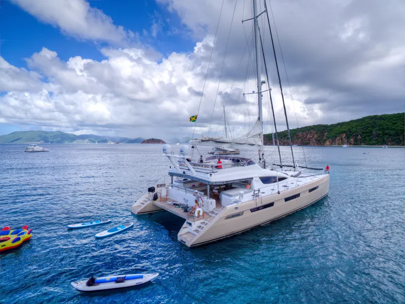 Slide: The Image of Luxury Privilege 745 catamaran yacht anchored in tropical waters, 2010 model. - 21