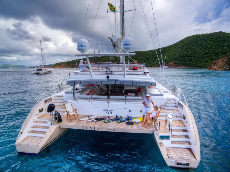 Slide: The Image of Luxury Privilege 745 yacht, 2010 model, anchored in scenic tropical waters with lush green hills. - 23