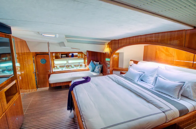 Slide: The Image of Luxurious bedroom interior of 2010 Privilege 745 yacht with wooden finishes and modern decor. - 29
