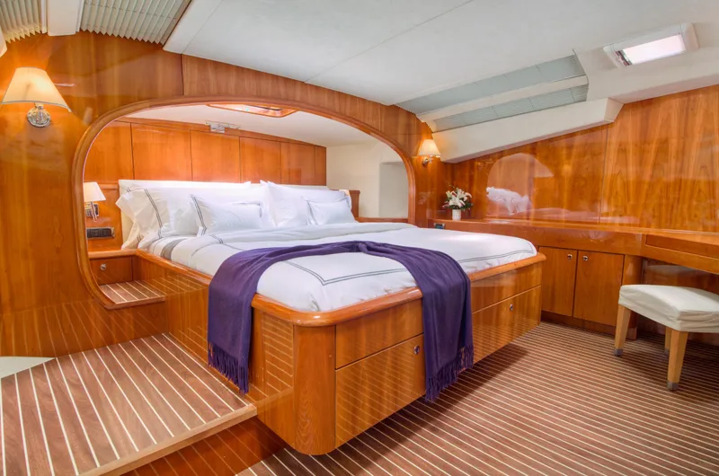 Slide: The Image of Luxurious master bedroom on a 2010 Privilege 745 yacht with wooden interiors. - 30
