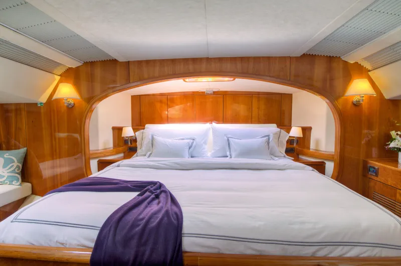 Slide: The Image of Luxurious bedroom interior of 2010 Privilege 745 yacht with cozy lighting and elegant bedding. - 31