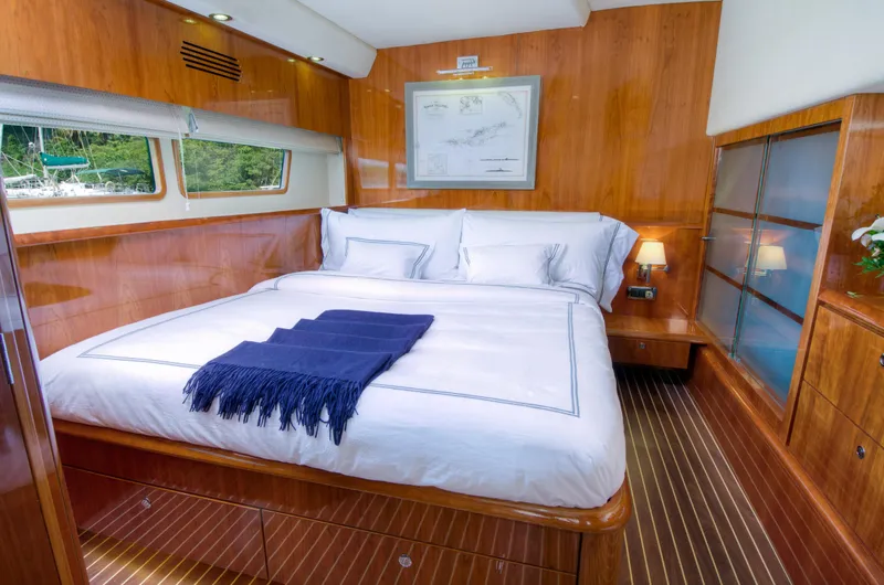 Slide: The Image of Luxurious bedroom in 2010 Privilege 745 yacht with wooden interiors and large bed. - 32