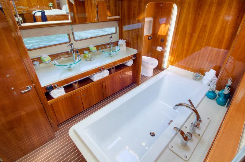 Slide: The Image of Luxurious bathroom on a 2010 Privilege 745 yacht with double sinks and a large bathtub. - 35