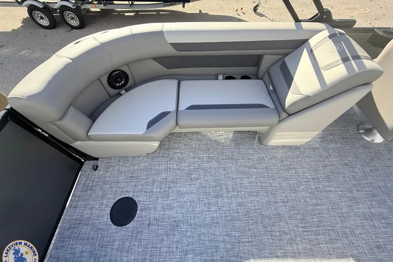 Slide: The Image of Luxurious seating on 2026 Premier 220 Sunscape RF boat, featuring gray upholstery and cup holders. - 12