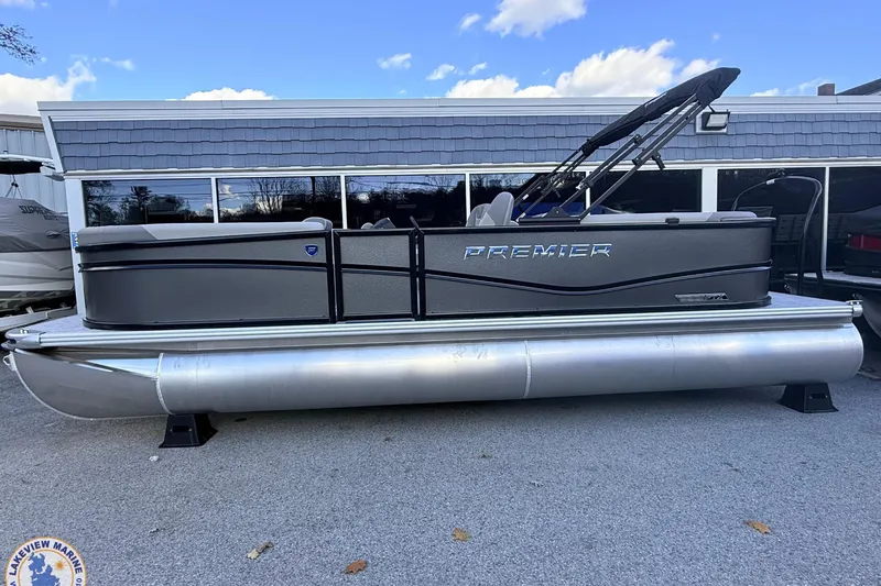 Slide: The Image of 2026 Premier 220 Sunscape RF pontoon boat displayed outdoors. - 2