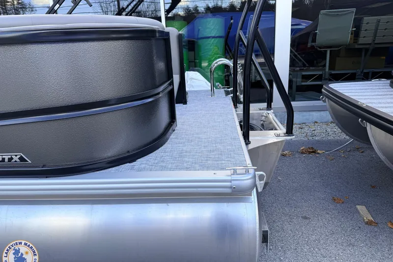 Slide: The Image of 2026 Premier 220 Sunscape RF pontoon boat, rear view with sleek design and modern features. - 3