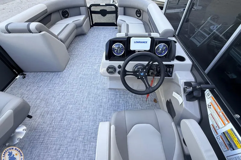 Slide: The Image of 2026 Premier 220 Sunscape RF boat interior with modern dashboard and comfortable seating. - 9