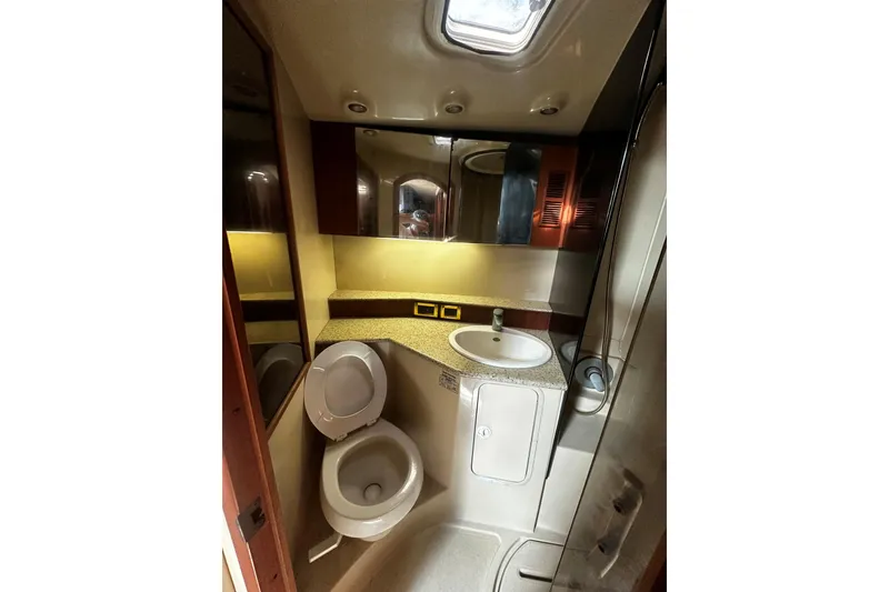 Slide: The Image of 2003 Rampage 38 Express yacht bathroom with sink, toilet, and shower. - 11