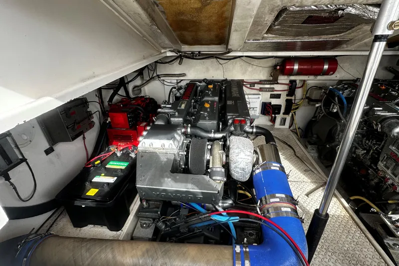 Slide: The Image of Engine room of a 2003 Rampage 38 Express boat, showcasing mechanical components. - 16