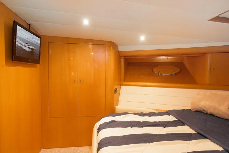 Slide: The Image of Interior of 2001 Uniesse 48 Open yacht with cozy bedroom and TV. - 19