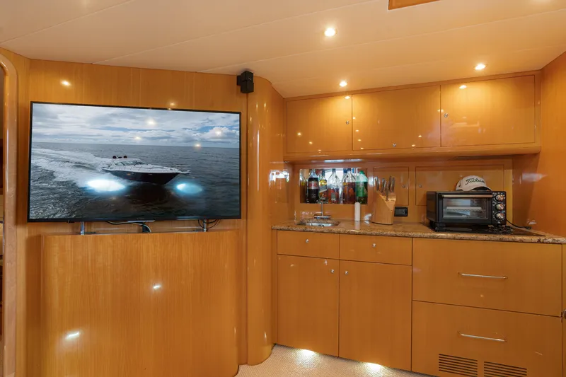 Slide: The Image of Interior of 2001 Uniesse 48 Open yacht with modern kitchen and large TV. - 20