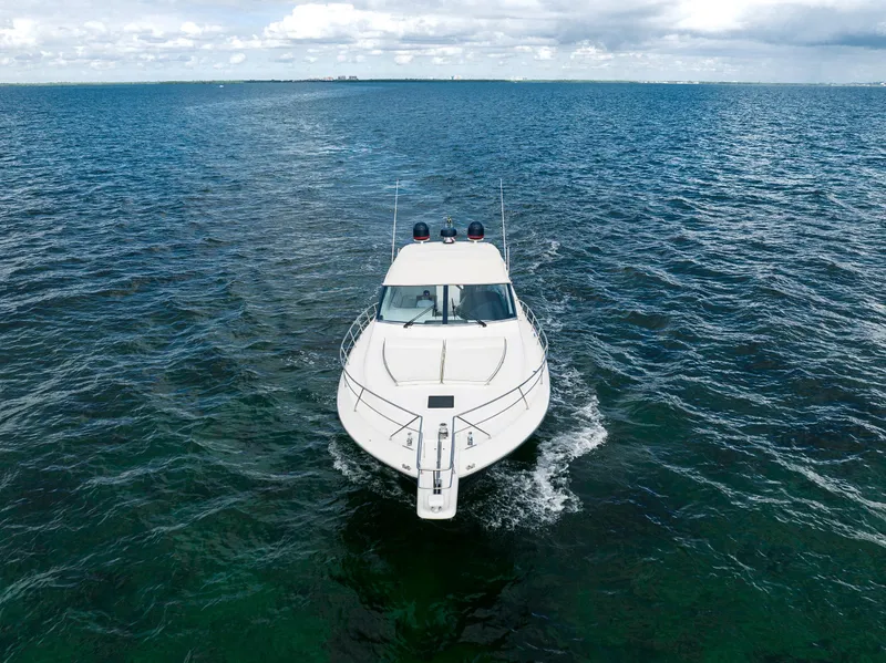 Slide: The Image of Uniesse 48 Open 2001 yacht cruising on open sea under cloudy sky. - 29
