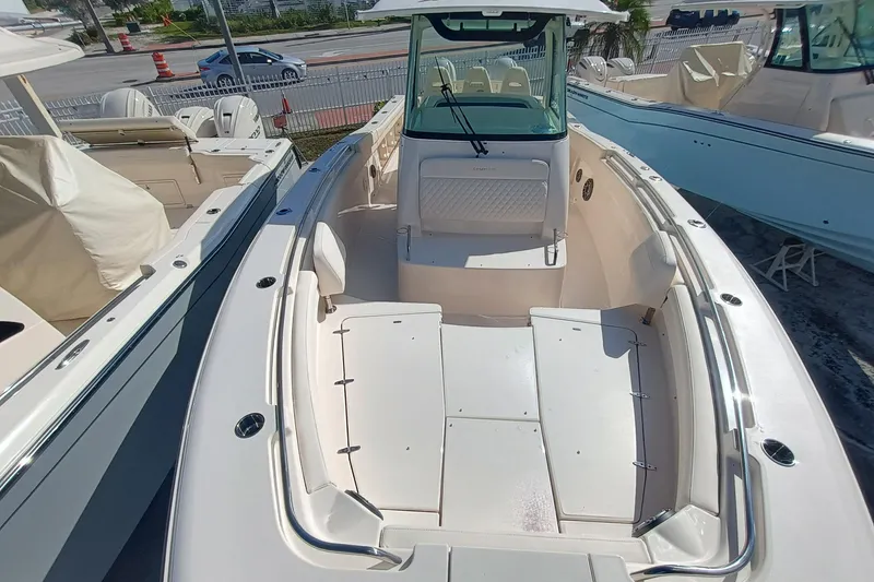 Slide: The Image of 2026 Grady-White Canyon 336 boat, front deck view at marina. - 14