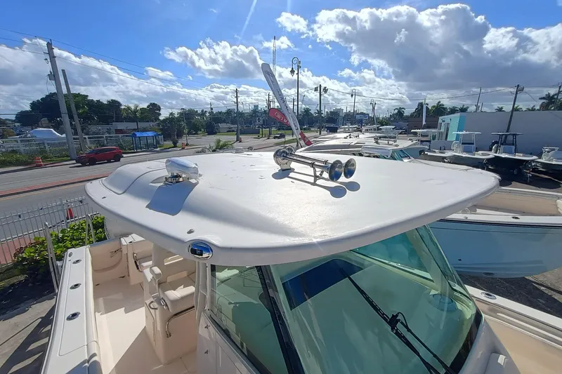 Slide: The Image of Grady-White Canyon 336 boat, 2026 model, on a sunny lot. - 15