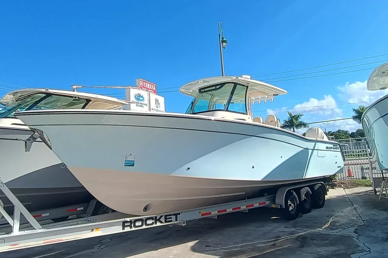 Slide: The Image of 2026 Grady-White Canyon 336 boat on trailer outdoors. - 2