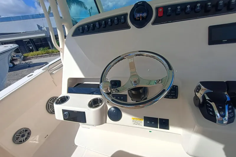 Slide: The Image of Helm console of Grady-White Canyon 336 boat, year 2026. - 23