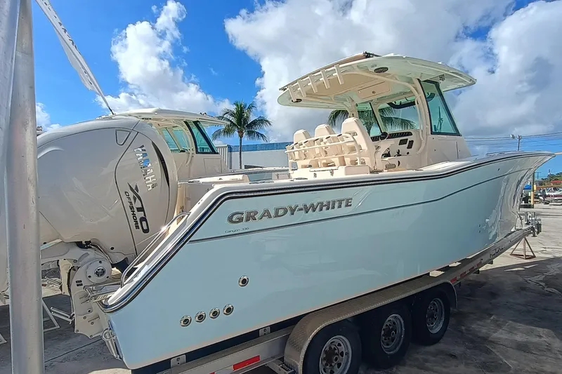 Slide: The Image of 2026 Grady-White Canyon 336 boat on trailer, sunny day. - 5