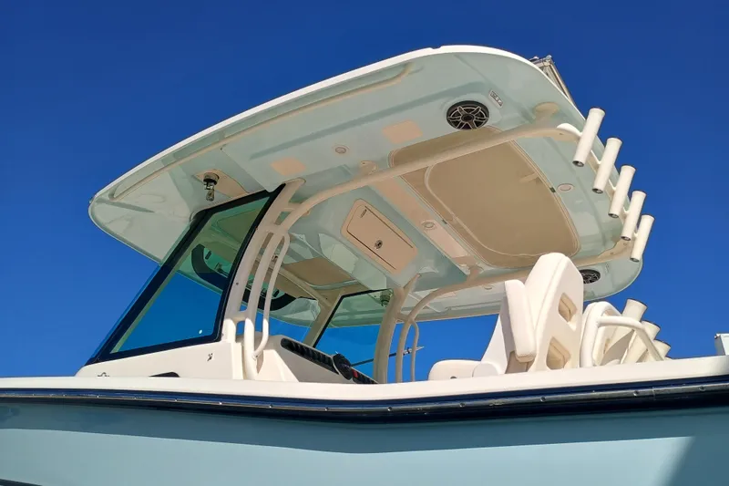 Slide: The Image of 2026 Grady-White Canyon 336 boat with blue sky. - 7