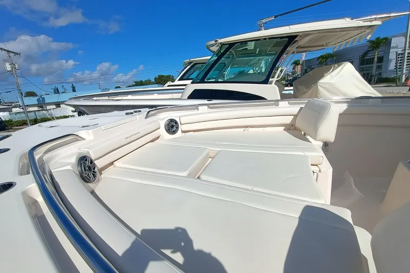 Slide: The Image of Grady-White Canyon 336 boat, 2026 model, featuring luxurious deck and blue sky. - 9