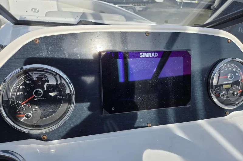 Slide: The Image of Dashboard of 2024 Godfrey Hurricane 235SD boat with Simrad display and gauges. - 11