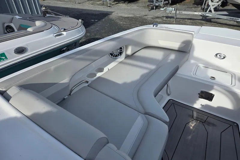 Slide: The Image of 2024 Godfrey Hurricane 235SD boat interior with sleek seating and cup holders. - 18