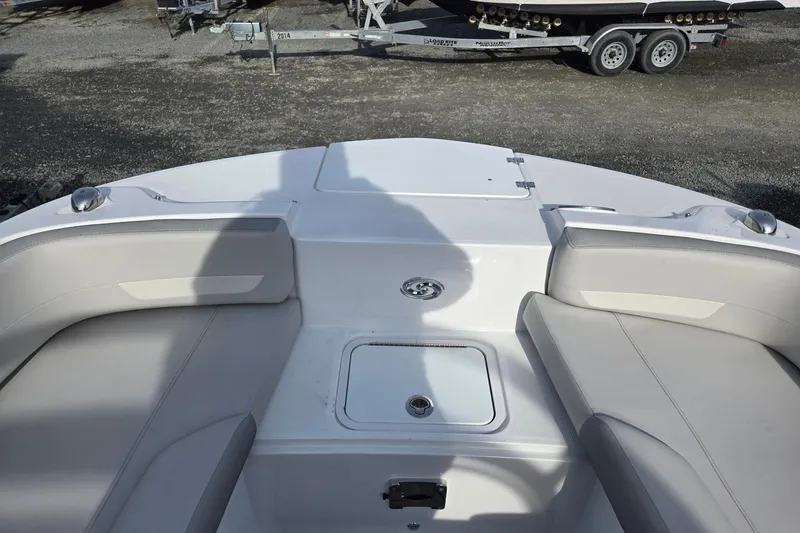 Slide: The Image of 2024 Godfrey Hurricane 235SD boat interior with seating and storage compartment. - 20