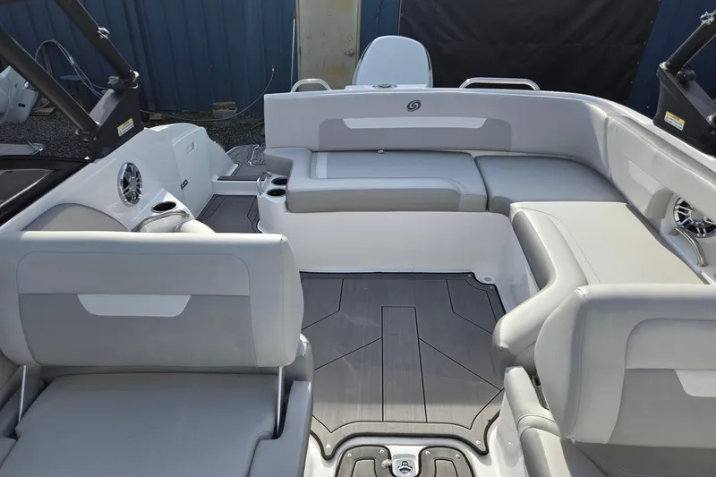 Slide: The Image of 2024 Godfrey Hurricane 235SD boat interior with gray seating and modern design. - 21