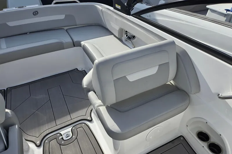 Slide: The Image of 2024 Godfrey Hurricane 235SD boat interior with gray seating and sleek design. - 22