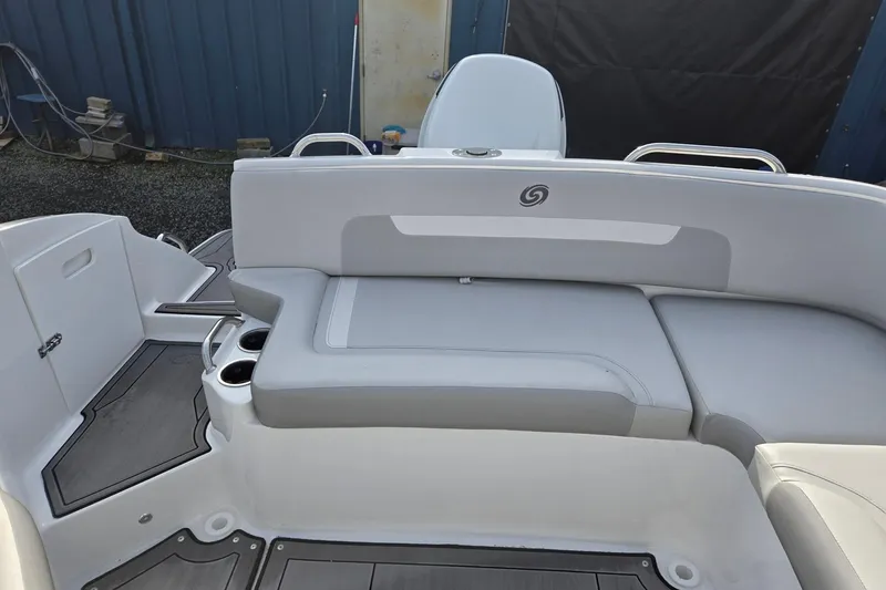 Slide: The Image of 2024 Godfrey Hurricane 235SD boat interior with gray seating and cup holders. - 24